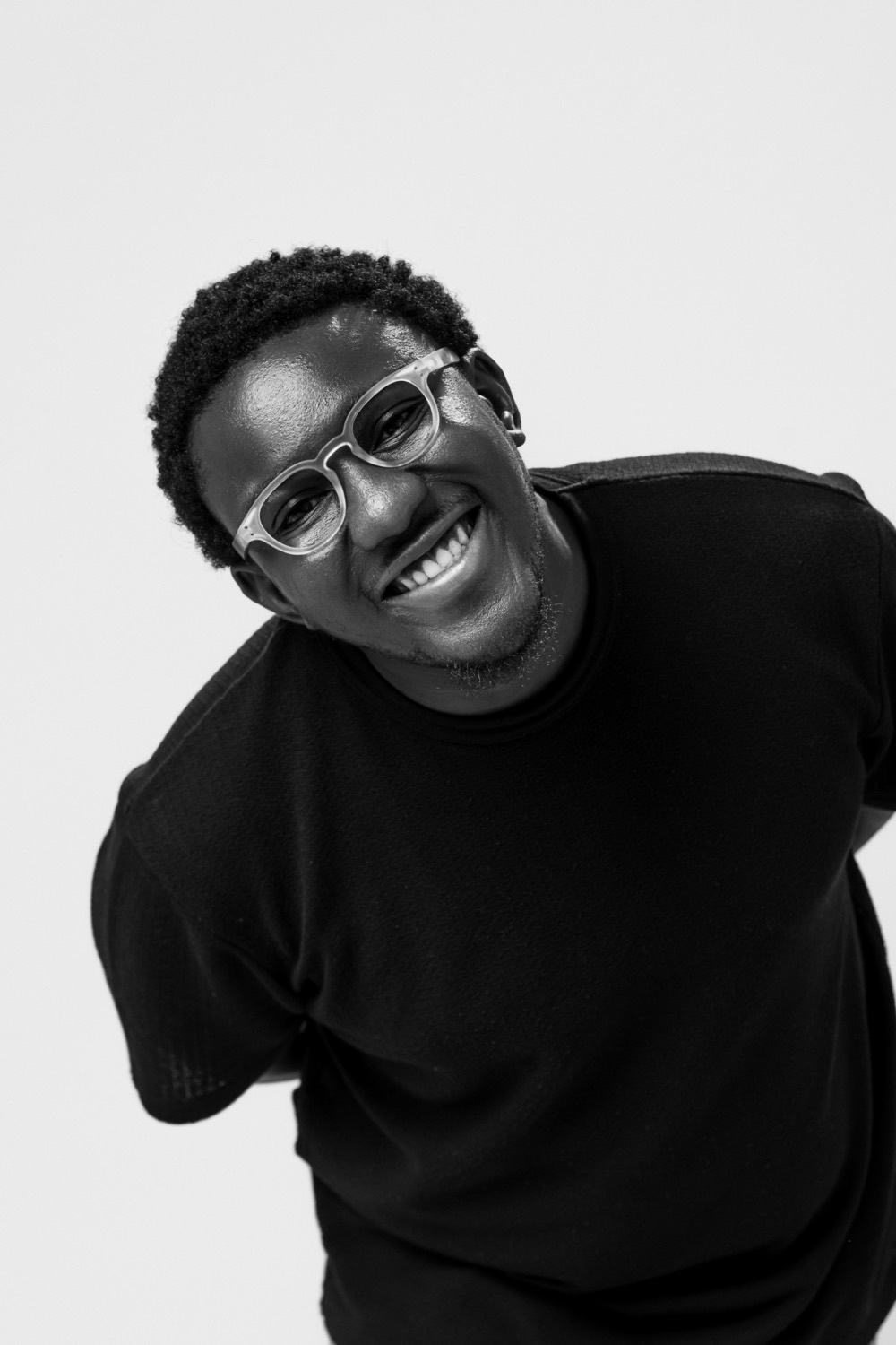 Editorial black-and-white portrait of Salem King smiling